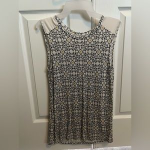 Off white women’s top with design of black and yellow. Size MEDIUM lightly used